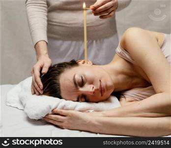 close up therapist using candle
