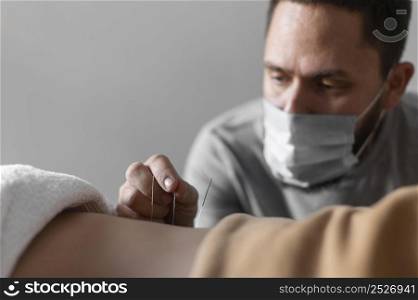 close up therapist wearing medical mask