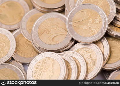 Close up top view image of large amount of Euro money coins.