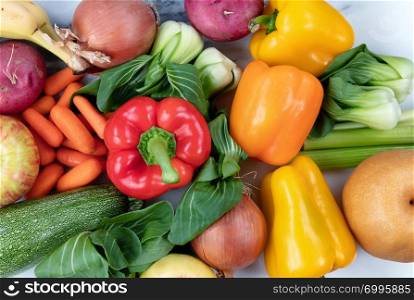 Close up top view of raw organic vegetables and fruits for healthy diet concept