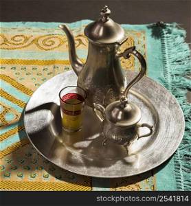 close up traditional arabic hot tea prayer rug