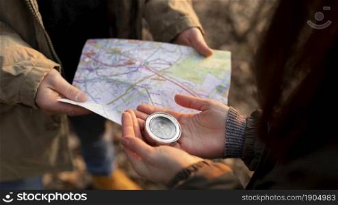 close up travelers with map compass. Beautiful photo. close up travelers with map compass