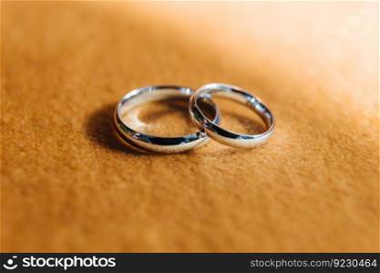 Close-up two silver wedding rings on fabric background. . Two silver wedding rings