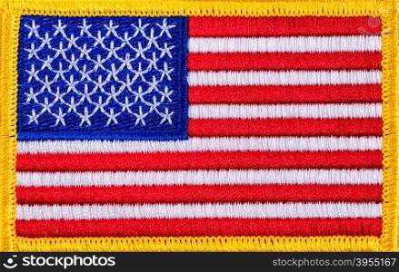 Close up USA flag with yellow trim in filled frame format.