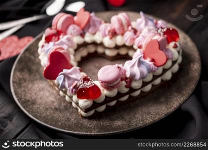 close up valentines day cake with macarons hearts