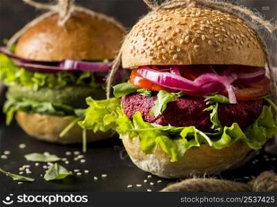 close up vegetarian burgers cutting board