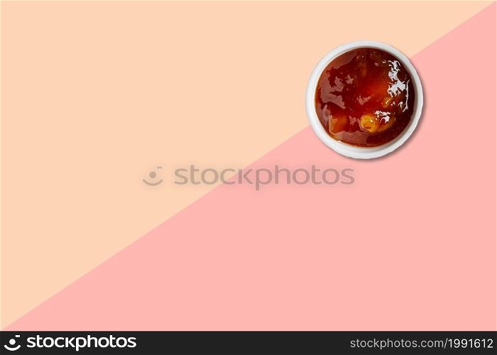 Close up view asian tapioca porridge with white ceramic isolated on pink background.