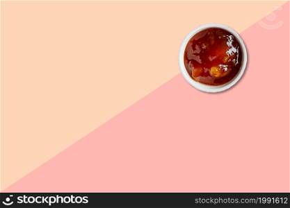Close up view asian tapioca porridge with white ceramic isolated on pink background.