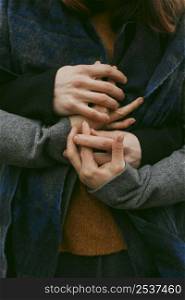 close up view couple holding hands