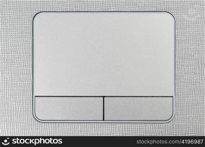 close up view of a grey laptop touchpad