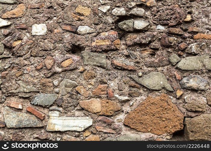 Close up view of a stone wall in background