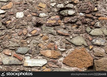 Close up view of a stone wall in background