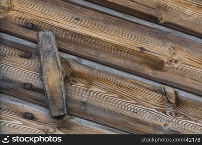 Close up view of a wooden handle of a door of a warehouse wood