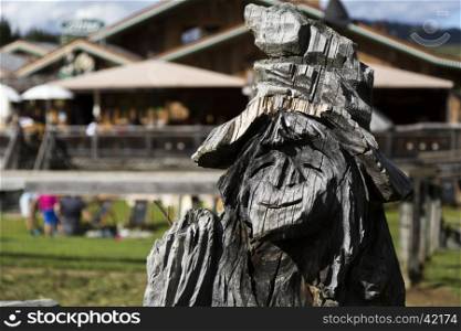 Close up view of a wooden statue of a witch