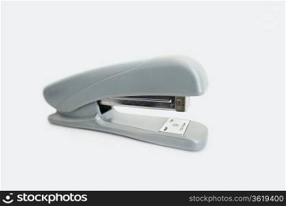 Close-up view of office stapler over white background