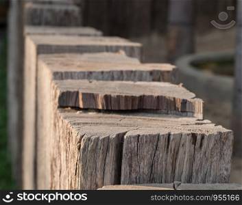 Close up view of old vintage chock wood, fence design countryside style.