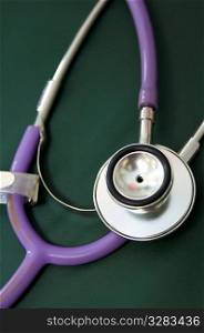 Close-up view of purple stethoscope.