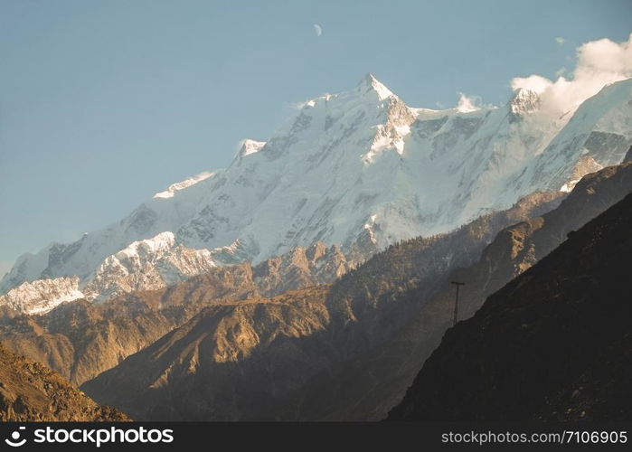 Close up view of snow capped Rakaposhi mountain in Karakoram range in Nagar valley. Gilgit Baltistan, Pakistan.