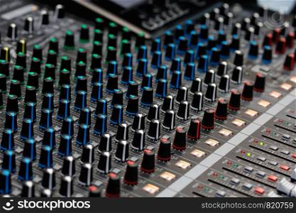Close up view of sound mixing console. Selective focus.