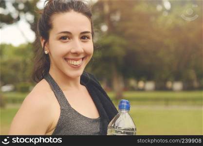 Close up view of sporty woman drinking water. Sport concept
