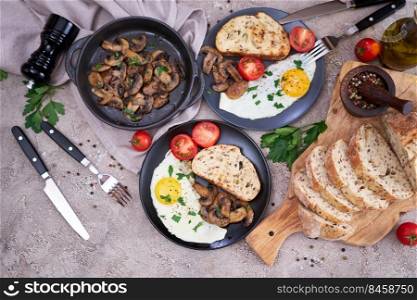 Close up view of the fried egg, mushrooms and bread on a plate.. Close up view of the fried egg, mushrooms and bread on a plate