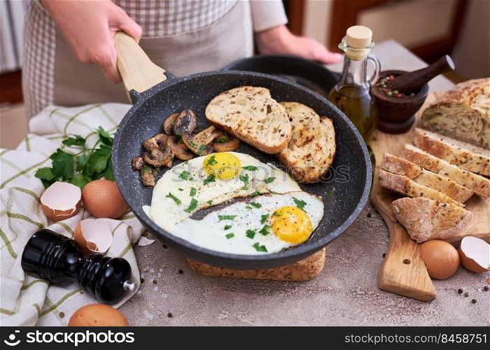 Close up view of the fried egg on a frying pan.. Close up view of the fried egg on a frying pan