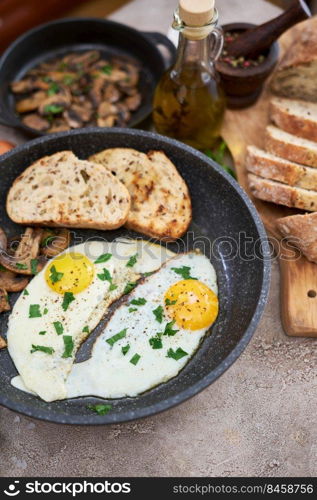 Close up view of the fried egg on a frying pan.. Close up view of the fried egg on a frying pan