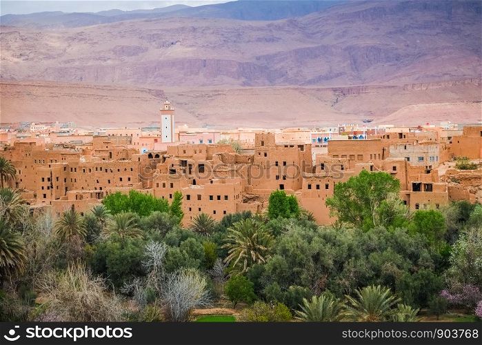 Close-up view of Tinghir city in the oasis, with Atlas mountain in the background. Morocco.