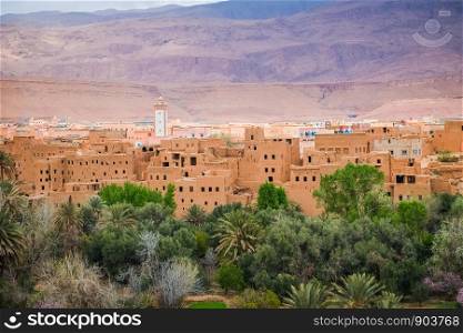 Close-up view of Tinghir city in the oasis, with Atlas mountain in the background. Morocco.
