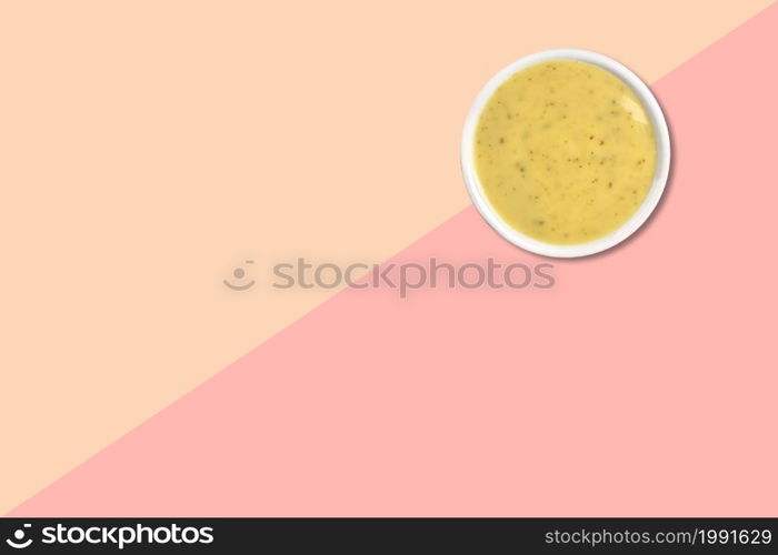 Close up view of wheat porridge isolated on pink background.