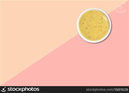 Close up view of wheat porridge isolated on pink background.