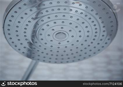 Close-up view on a modern metal shower. Horizontal photo