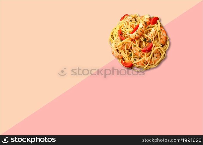 Close up view spaghetti with prawns isolated on pink background.