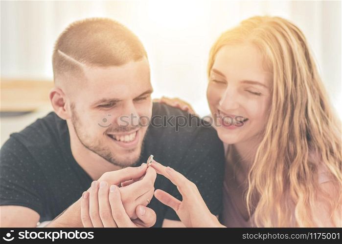 Close up Wedding Ring Couple live in bedroom happiness in love Valentine?s day concept and Couples propose marry with rings