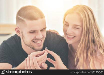 Close up Wedding Ring Couple live in bedroom happiness in love Valentine?s day concept and Couples propose marry with rings