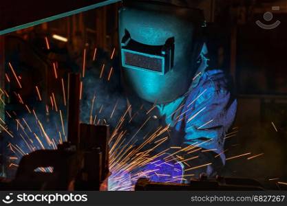 Close up welder in factory welding automotive part in factory