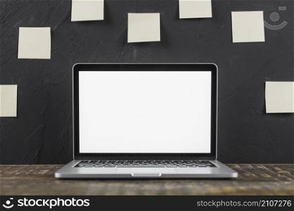 close up white blank screen laptop wooden table