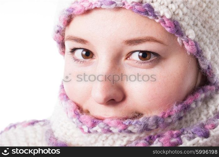 Close up woman&amp;#39;s face wrapped in the scarf under the snowstorm