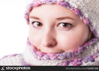 Close up woman&amp;#39;s face wrapped in the scarf under the snowstorm