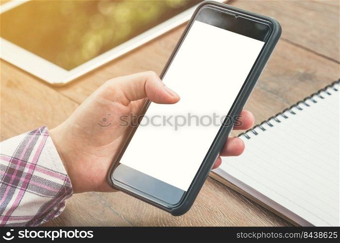 close up woman hand holding phone blank white screen display with vintage toned.