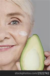 close up woman holding avocado 2
