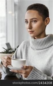 close up woman holding coffee cup