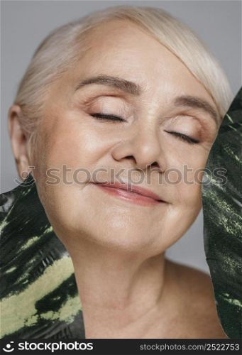 close up woman holding leaves