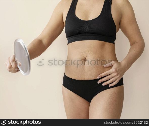close up woman holding mirror