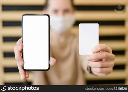 close up woman holding mobile phone card