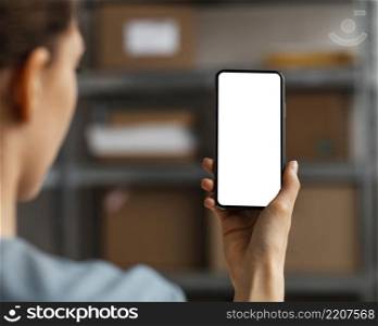 close up woman holding mobile with blank screen