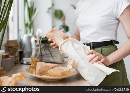 close up woman holding organic bread