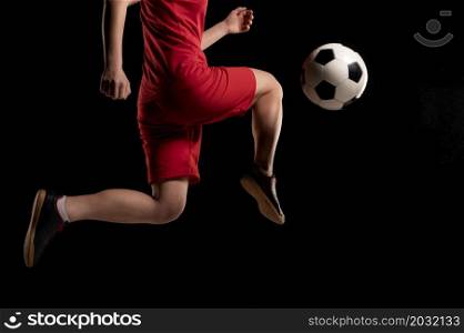 close up woman kicking ball with knee
