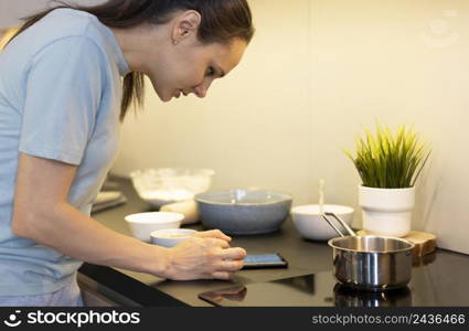 close up woman looking smartphone