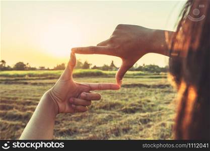 close up woman make hand framing gesture distant view. business concept